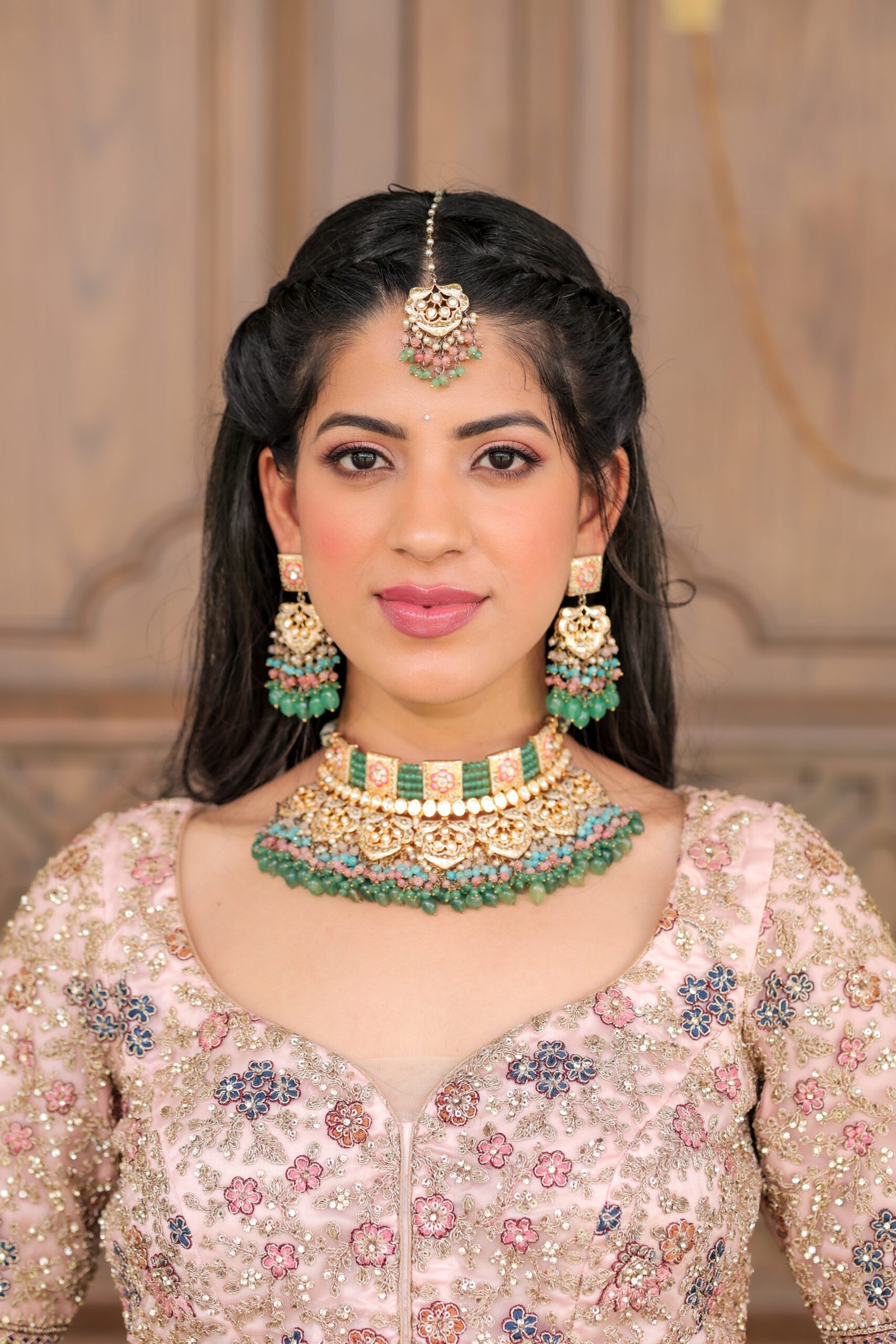 Makeup artist applying makeup to client at home in Dehradun